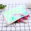 Trousse de toilette transparente colorée