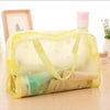 Trousse de toilette transparente fleurs