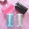 Trousse de toilette transparente paillette étoile
